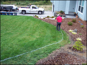 Marking the line for new landscape curb.