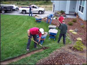 Removing the sod and prepping the trench.